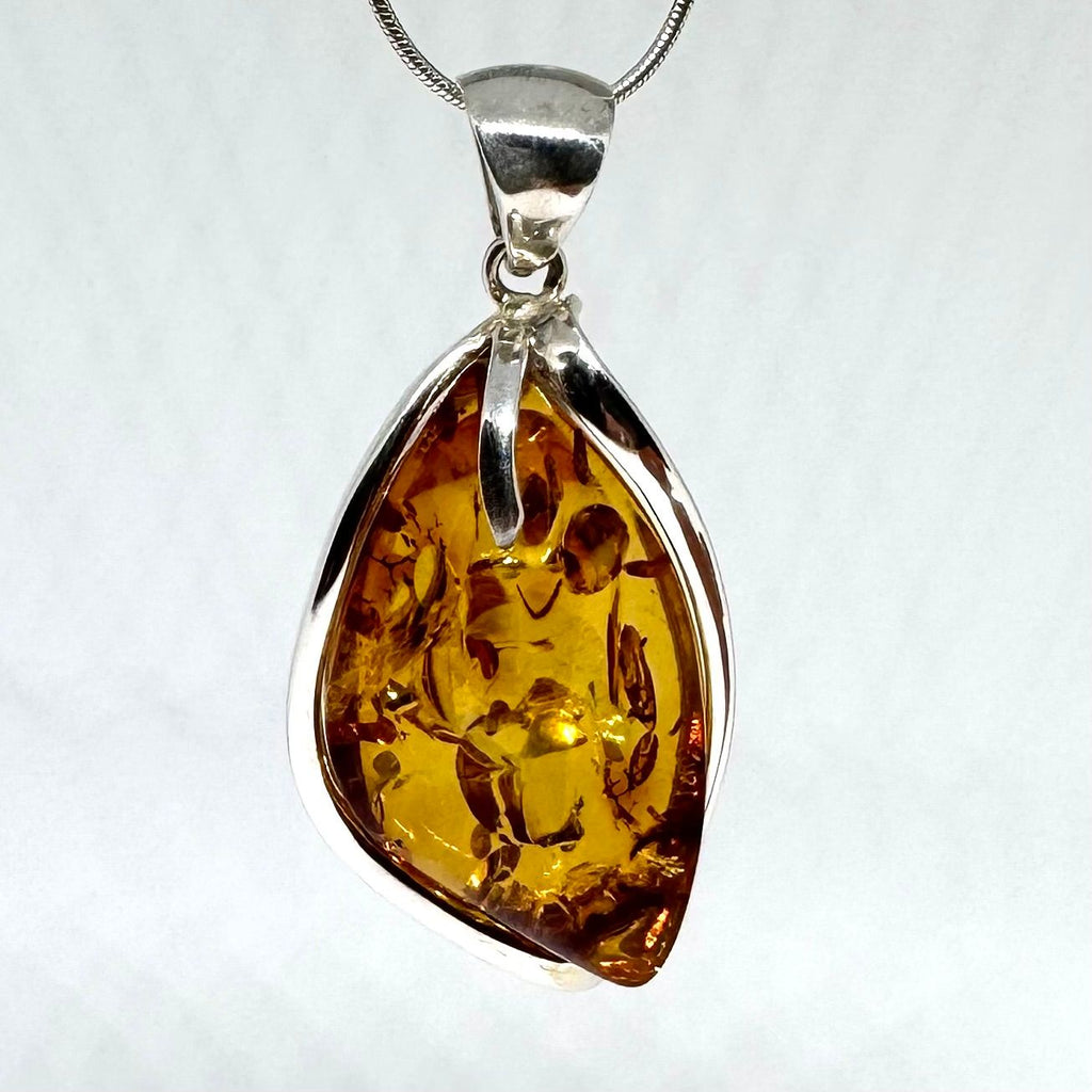 Unique Modern Amber Pendant in Silver Setting