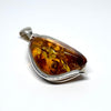 Unique Modern Amber Pendant in Silver Setting