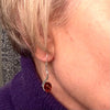 Amber Earring on a Silver Wave