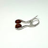 Amber Earring on a Silver Wave