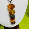 Five Amber Balls on Black Cord Necklace