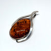 Unique Amber Pendant in Wishbone Silver Setting