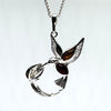 Hummingbird and a Flower Pendant in Silver and Amber