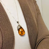 Large Amber Pendant with a Silver Leaf