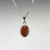 Amber Pendant is Silver Celtic Setting