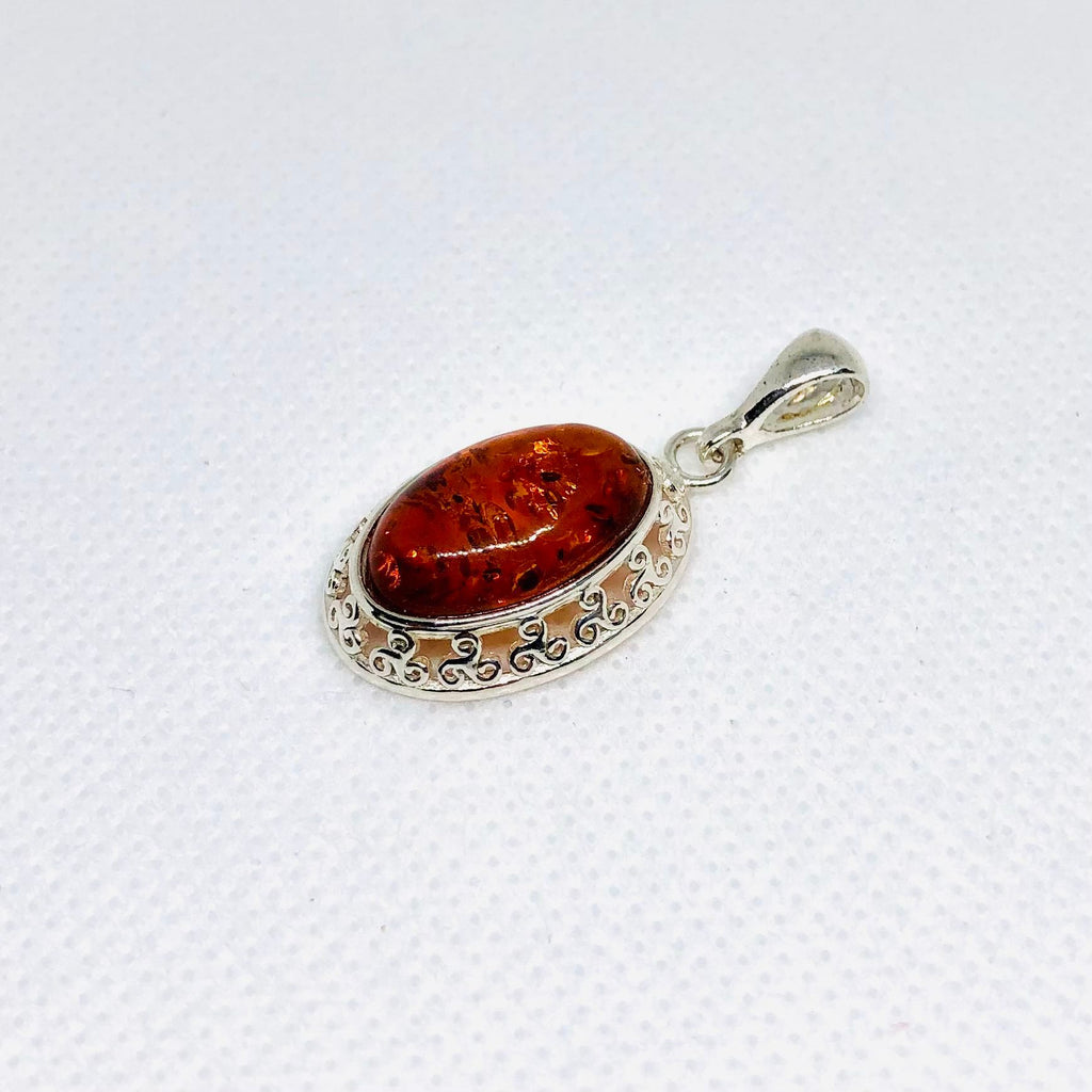 Amber Pendant is Silver Celtic Setting
