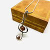 Treble Clef Pendant in Silver with Amber